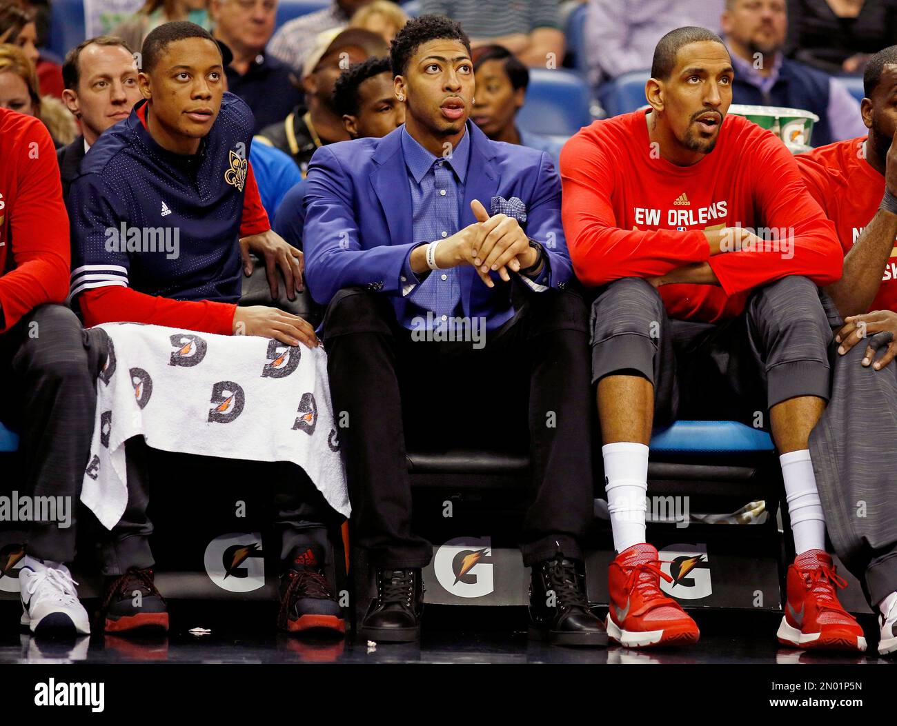 New Orleans Pelicans forward Anthony Davis, center, sits on the bench