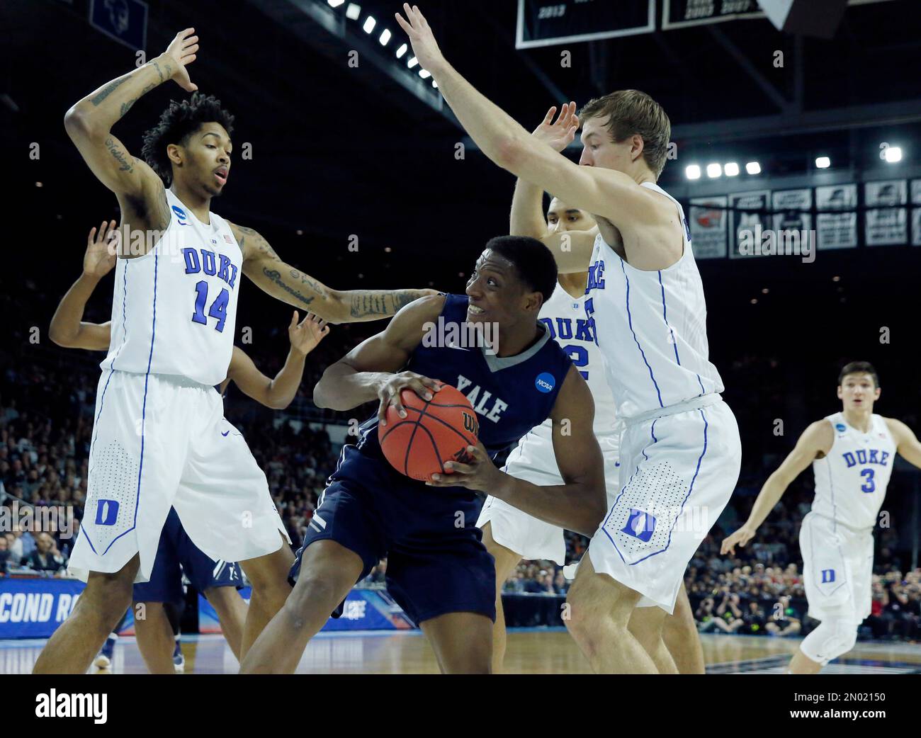 Duke's Luke Kennard (5) and Marshall Plumlee (40) double-team Yale's  Brandon Sherrod (35) during the second half in the second round of the NCAA  men's college basketball tournament in Providence, R.I., Saturday