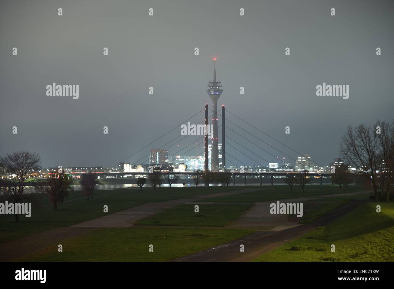 TV tower and Theodor Heuss bridge at night and fog in Dusseldorf TV tower and Theodor Heuss bridge at night and fog in Dusseldorf