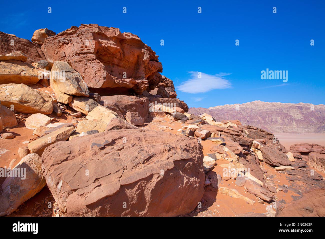 Wadi Rum desert in Jordan. Beautiful rocky mountains landscape and blue sky. Stock Photo
