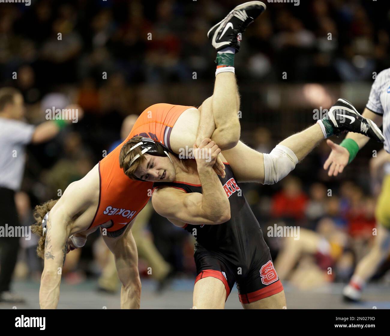 North Carolina State's Pete Renda, right, flips Virginia Tech's Zachary Zavatsky in a 184pound