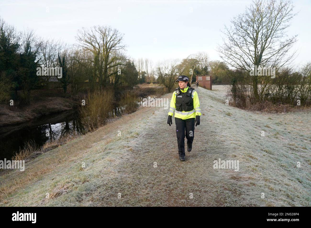 A PCSO walks along the River Wyre in St Michael's on Wyre, Lancashire, as police continue their search for missing woman Nicola Bulley, 45, who was last seen on the morning of Friday January 27, when she was spotted walking her dog on a footpath by the nearby River Wyre. Picture date: Sunday February 5, 2023. Stock Photo