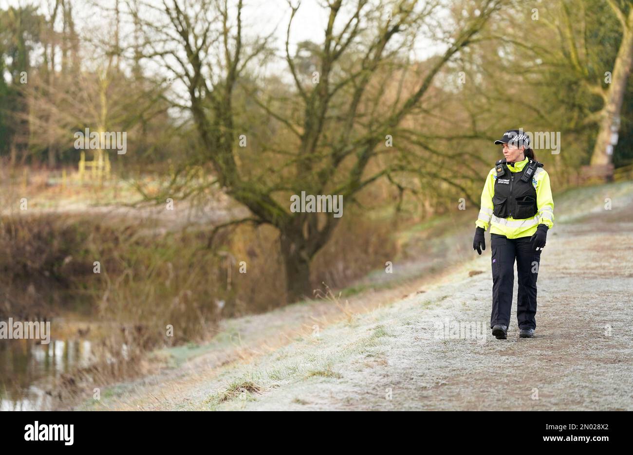 A PCSO walks along the River Wyre in St Michael's on Wyre, Lancashire, as police continue their search for missing woman Nicola Bulley, 45, who was last seen on the morning of Friday January 27, when she was spotted walking her dog on a footpath by the nearby River Wyre. Picture date: Sunday February 5, 2023. Stock Photo