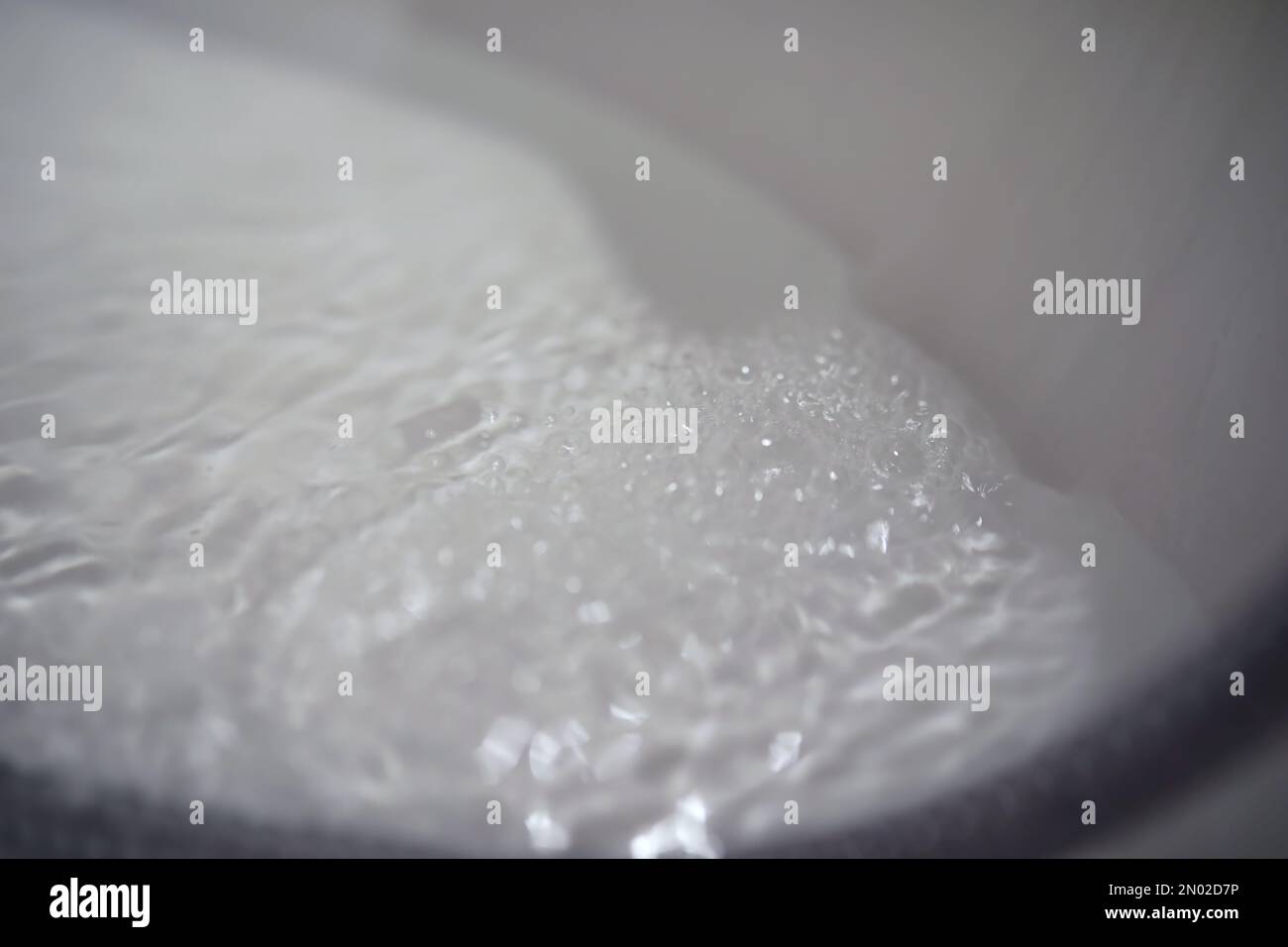 Soap bubbles background. Shampoo foam in the water in bathroom. Jacuzzi