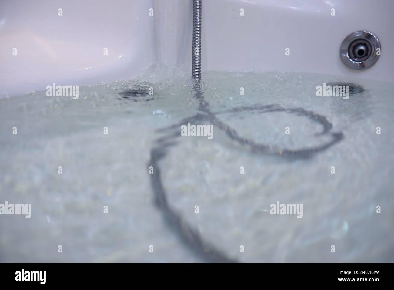 Soap bubbles background. Shampoo foam in the water in bathroom. Jacuzzi