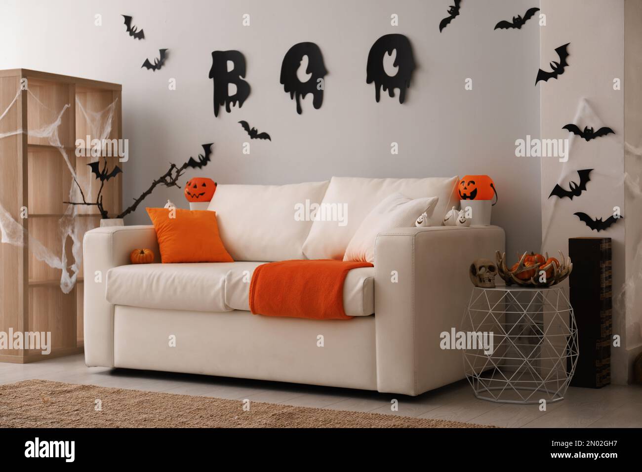 Stylish room interior with creative Halloween decor Stock Photo - Alamy