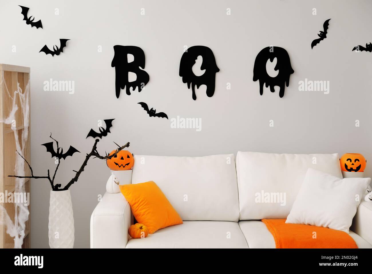 Stylish room interior with creative Halloween decor Stock Photo - Alamy
