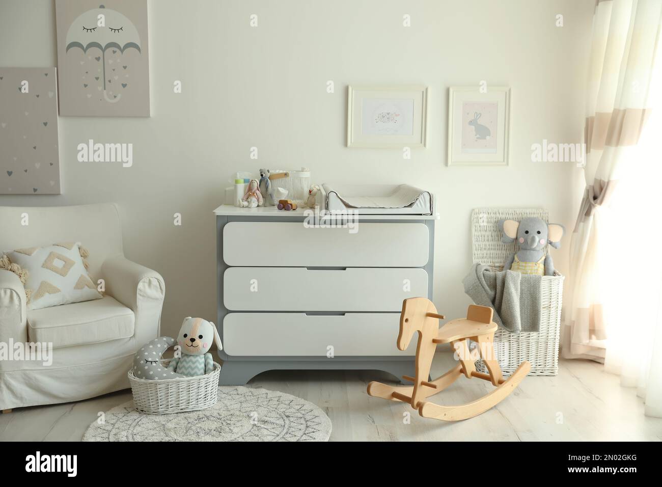 Beautiful baby room interior with toys armchair and modern