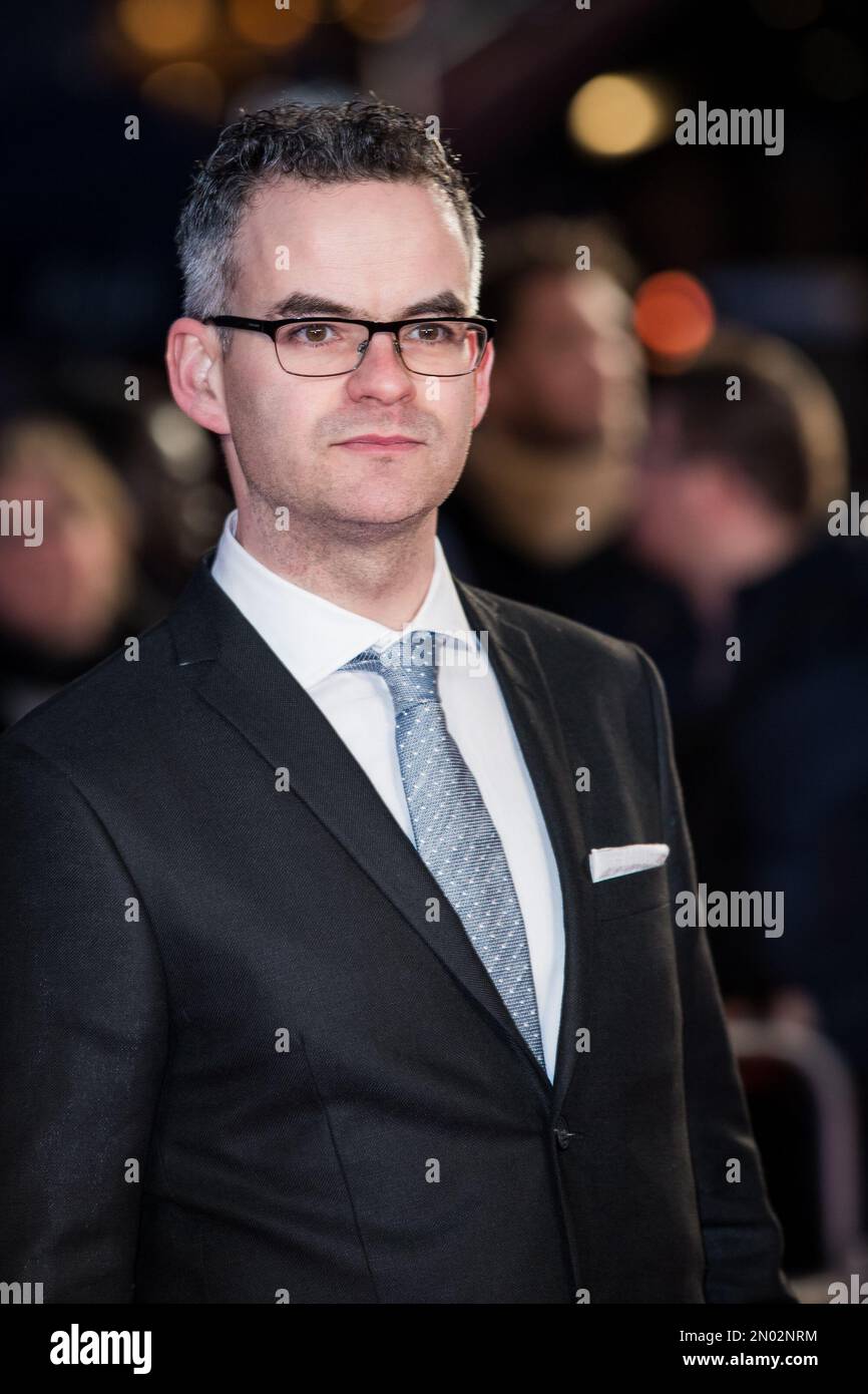 John Donnelly poses for photographers upon arrival at the world