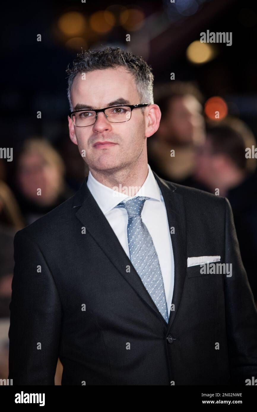 John Donnelly poses for photographers upon arrival at the world