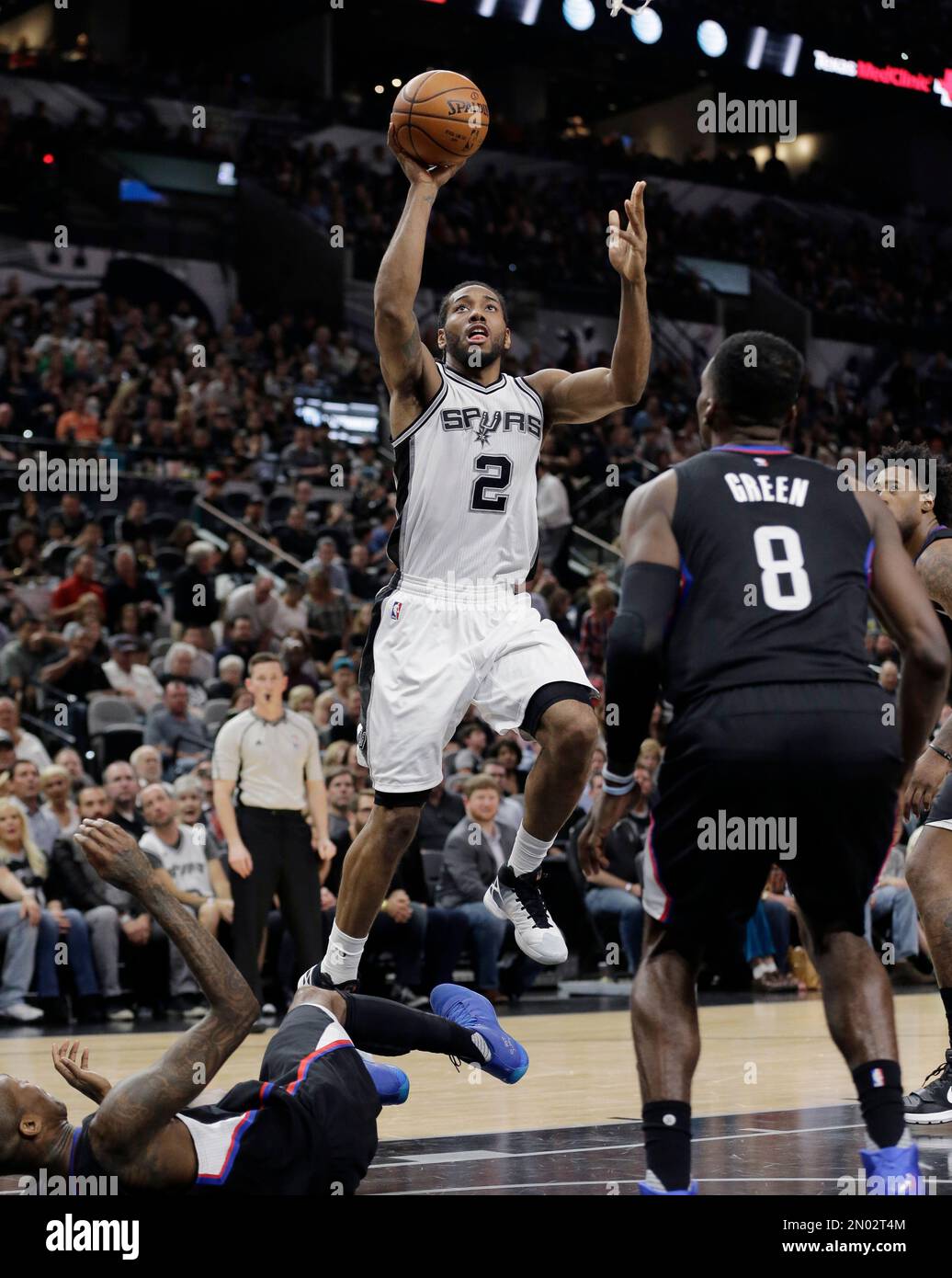 San Antonio Spurs forward Kawhi Leonard (2) congratulates Spurs center Tim  Duncan, center, with Spurs forward Boris Diaw, right, of France for picking  up a foul after making a shot against the