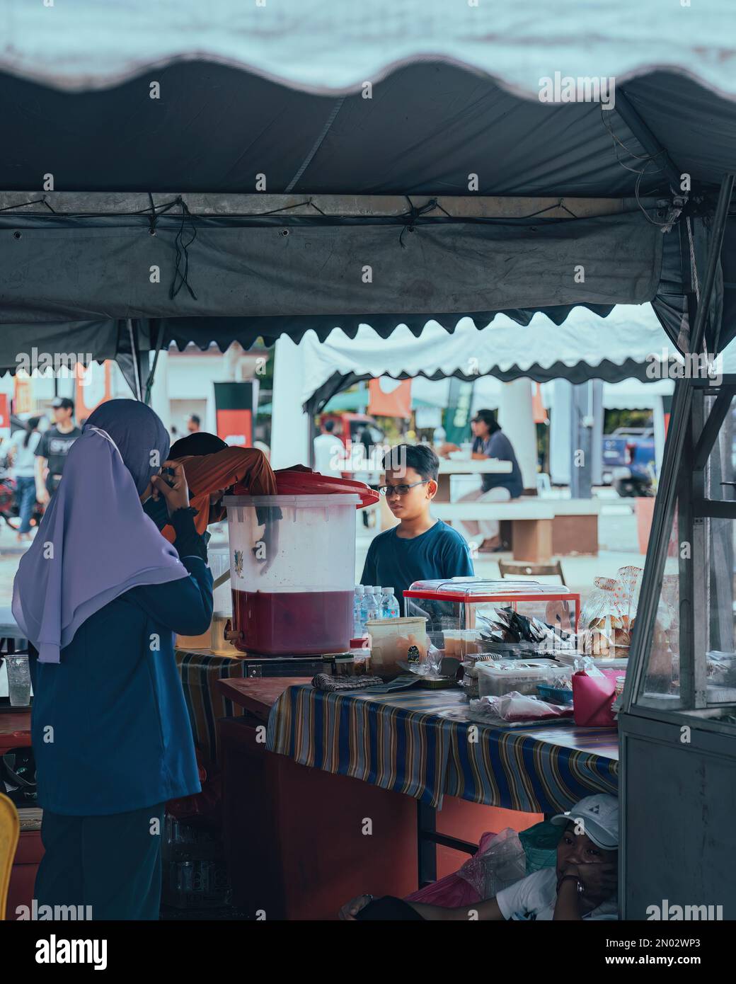 Pahang, Malaysia - Sep 23, 2022 Drinking stall food vendor selling local snacks. Stock Photo