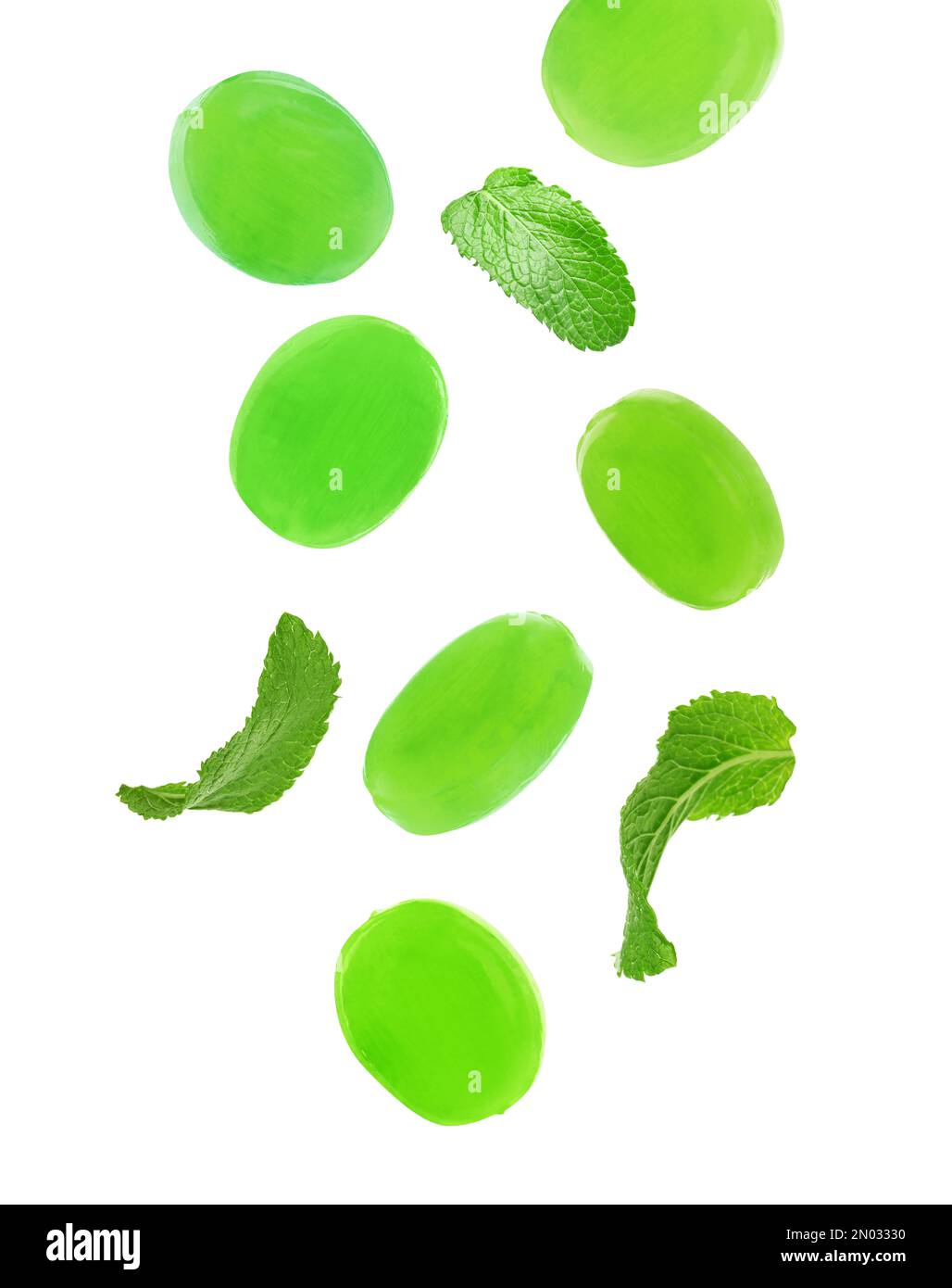 Mints Falling Mint hard candies and green leaves falling on white background Stock ...