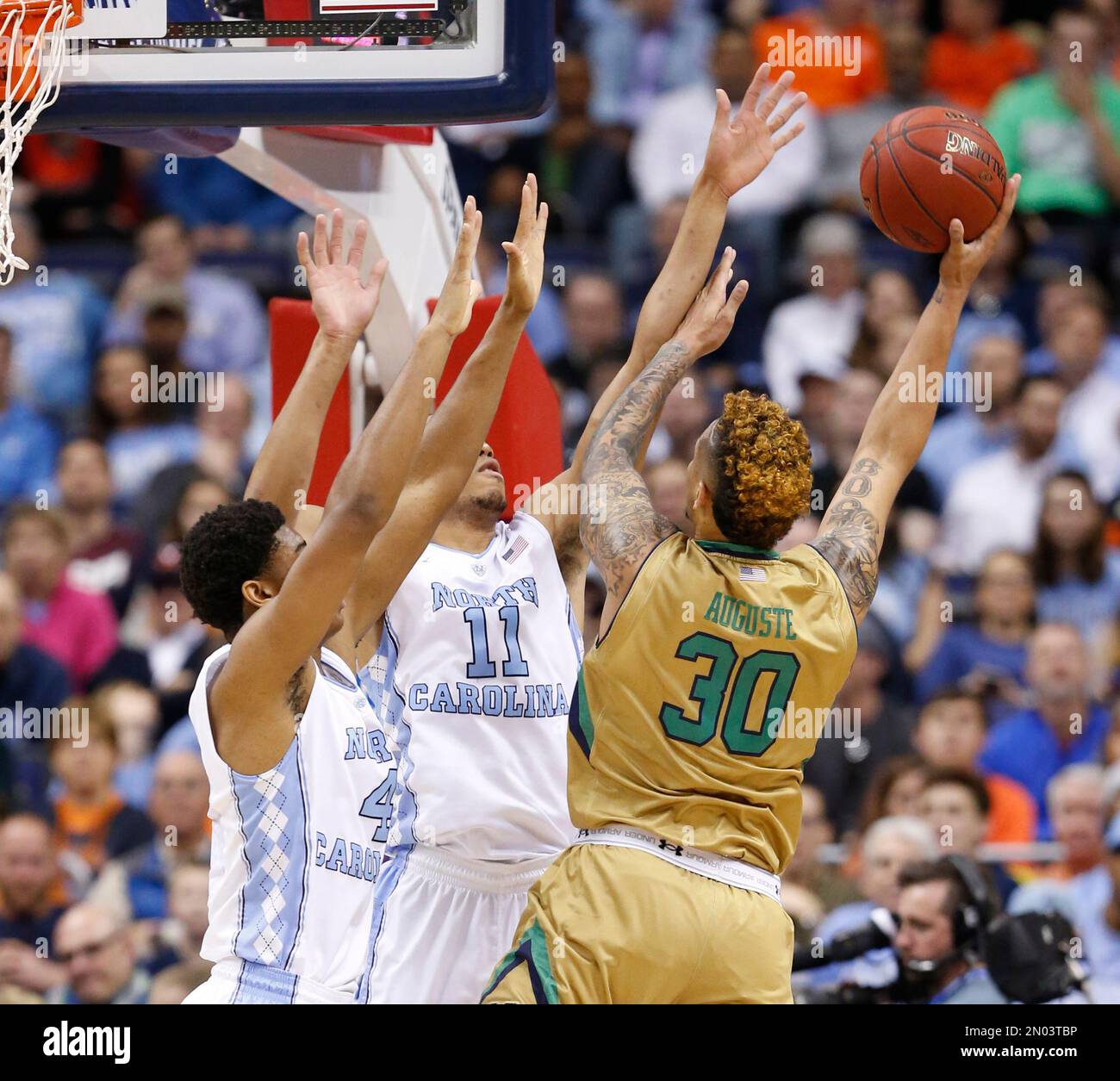 Notre Dame forward Zach Auguste (30) shoots as North Carolina forwards