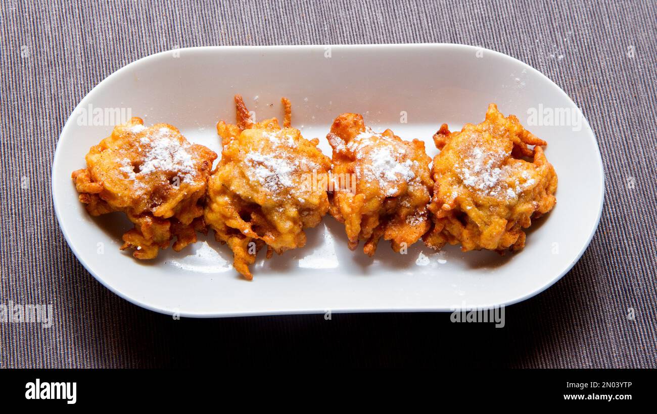 Fritters prepared with flour and apple. Traditional Spanish recipe Stock Photo