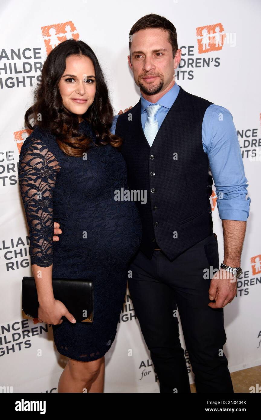 Actress Melissa Fumero poses with her husband David Fumero at The