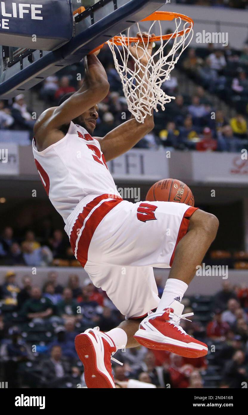Wisconsin's Vitto Brown (30) dunks in the first half of an NCAA college basketball game against