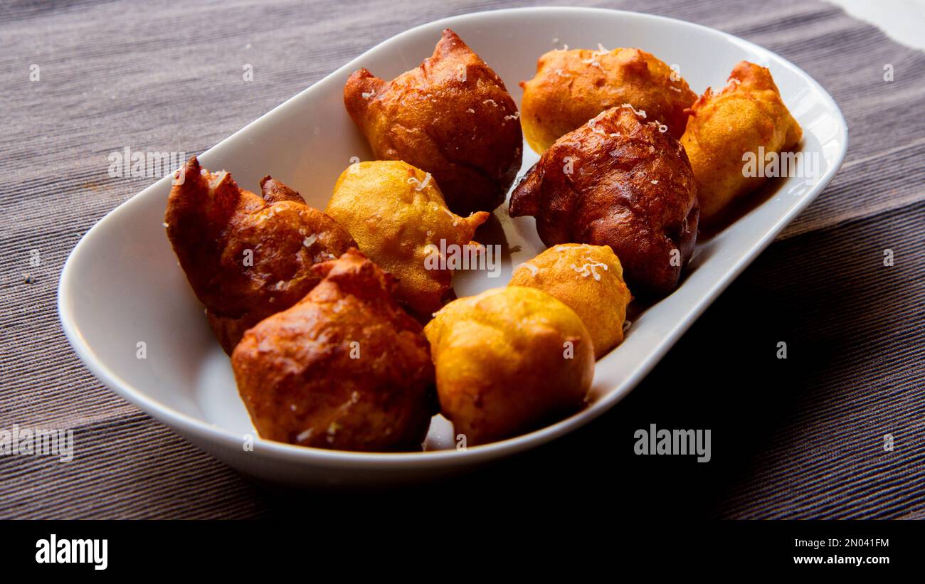 Fritters prepared with flour and pumpkin. Traditional Spanish recipe Stock Photo