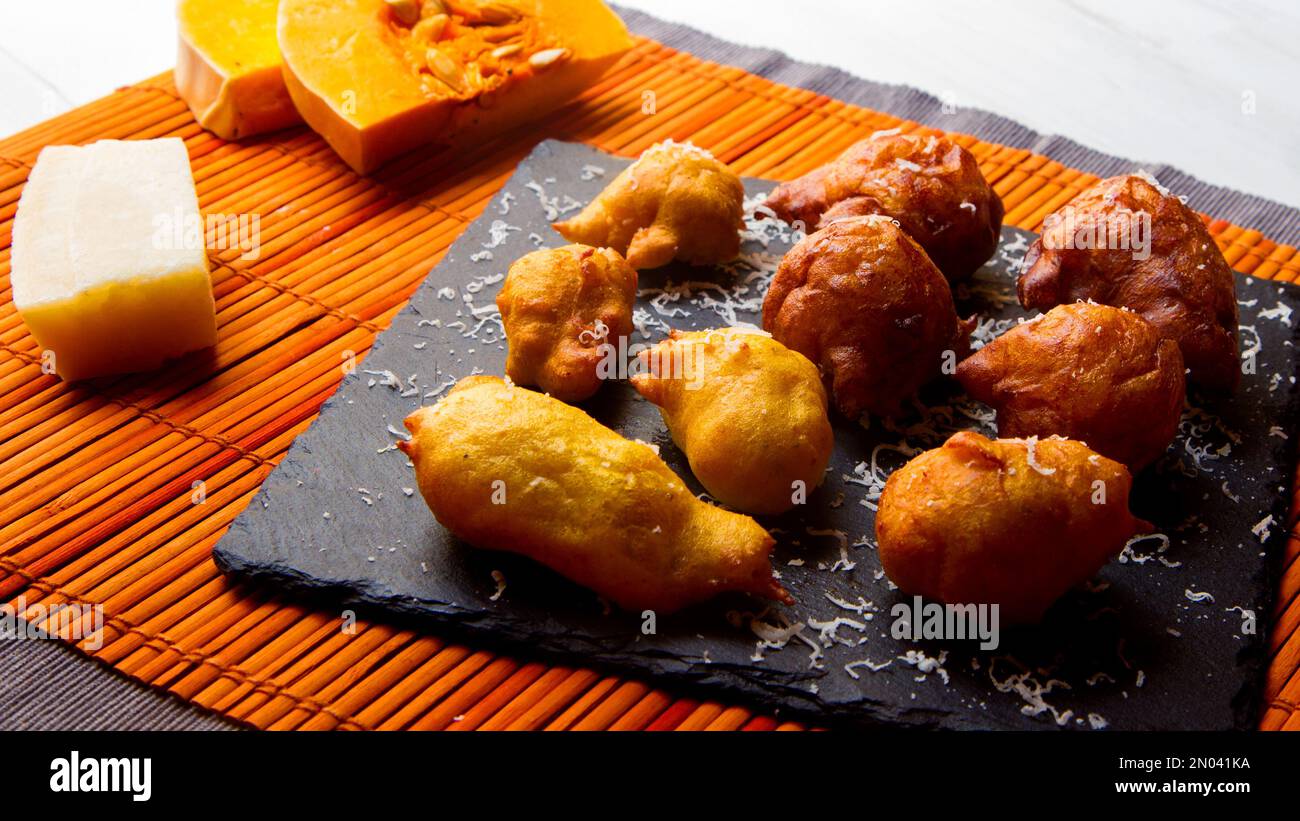 Fritters prepared with flour and pumpkin. Traditional Spanish recipe Stock Photo