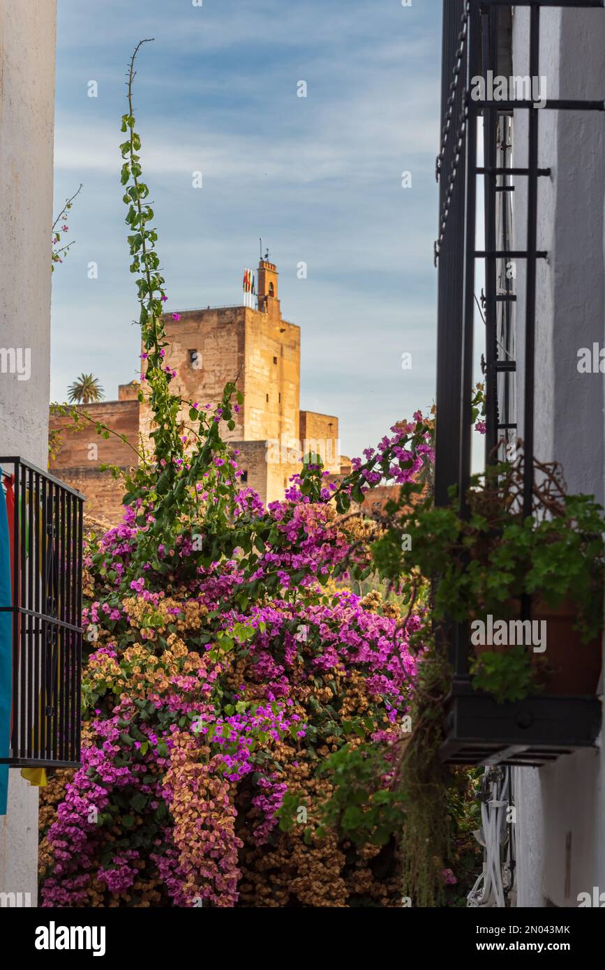 The candle tower of the Alhambra in Granada seen from a street in the Arab quarter of Albayzin. Stock Photo