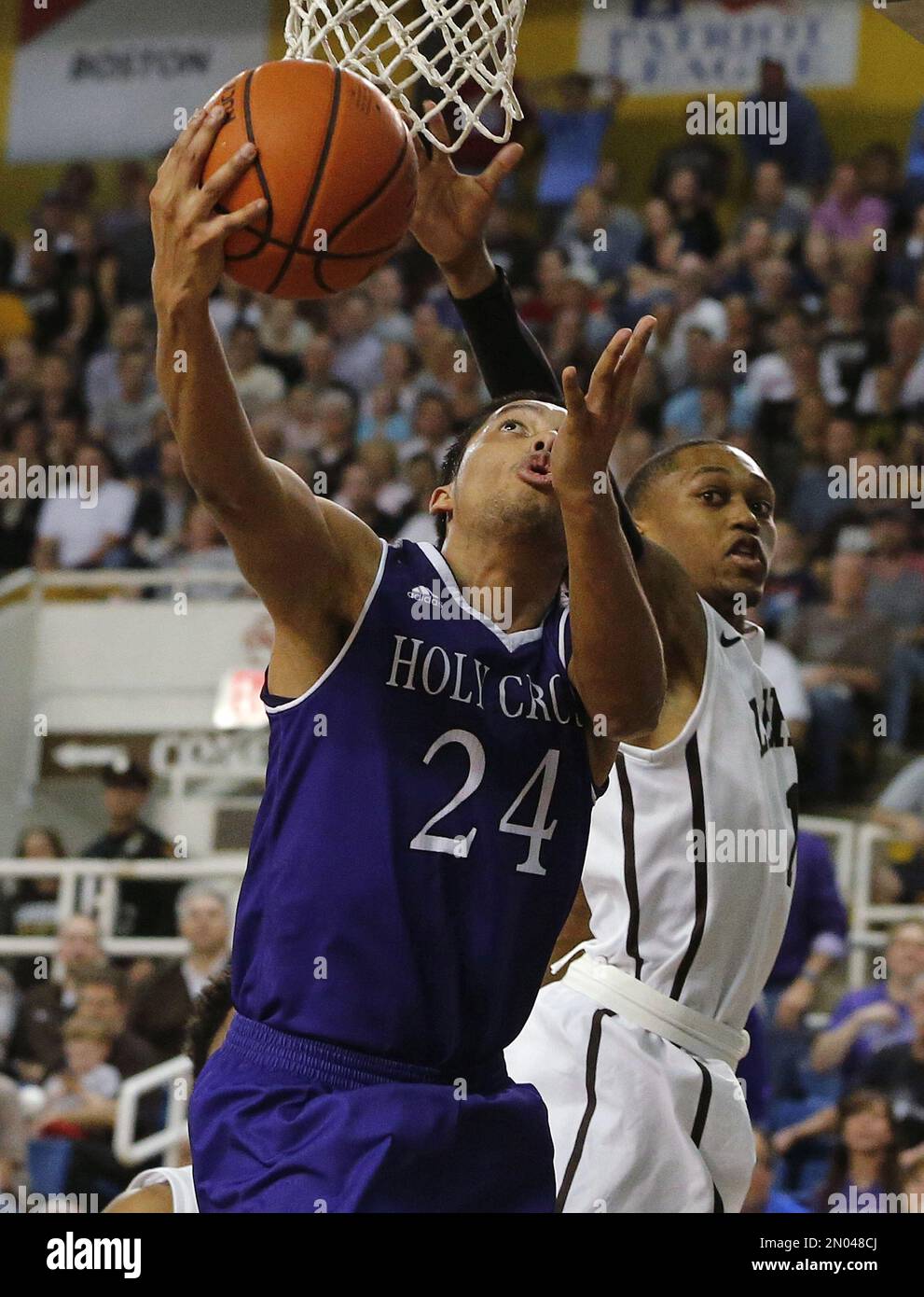 Holy Cross forward Eric Green (24) attempts a layup as Lehigh guard