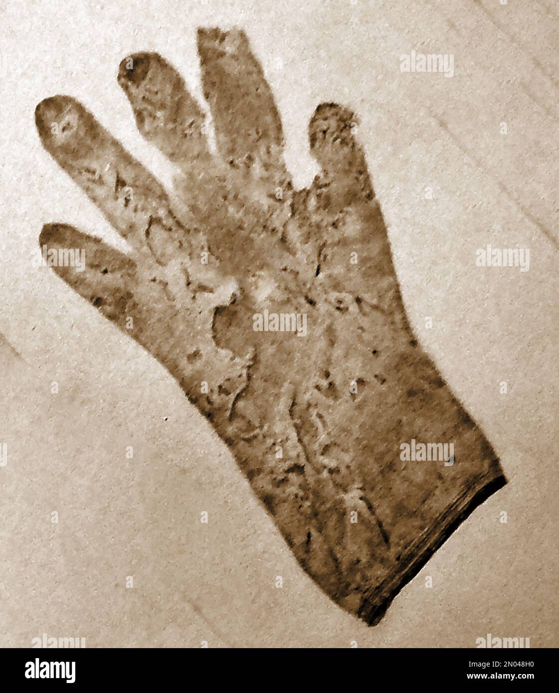 British pubs inns & taverns - A circa 1940 old photograph of An 18th century sailor's glove found in the bombed out roof space of the George at Portsmouth in WWII. Stock Photo