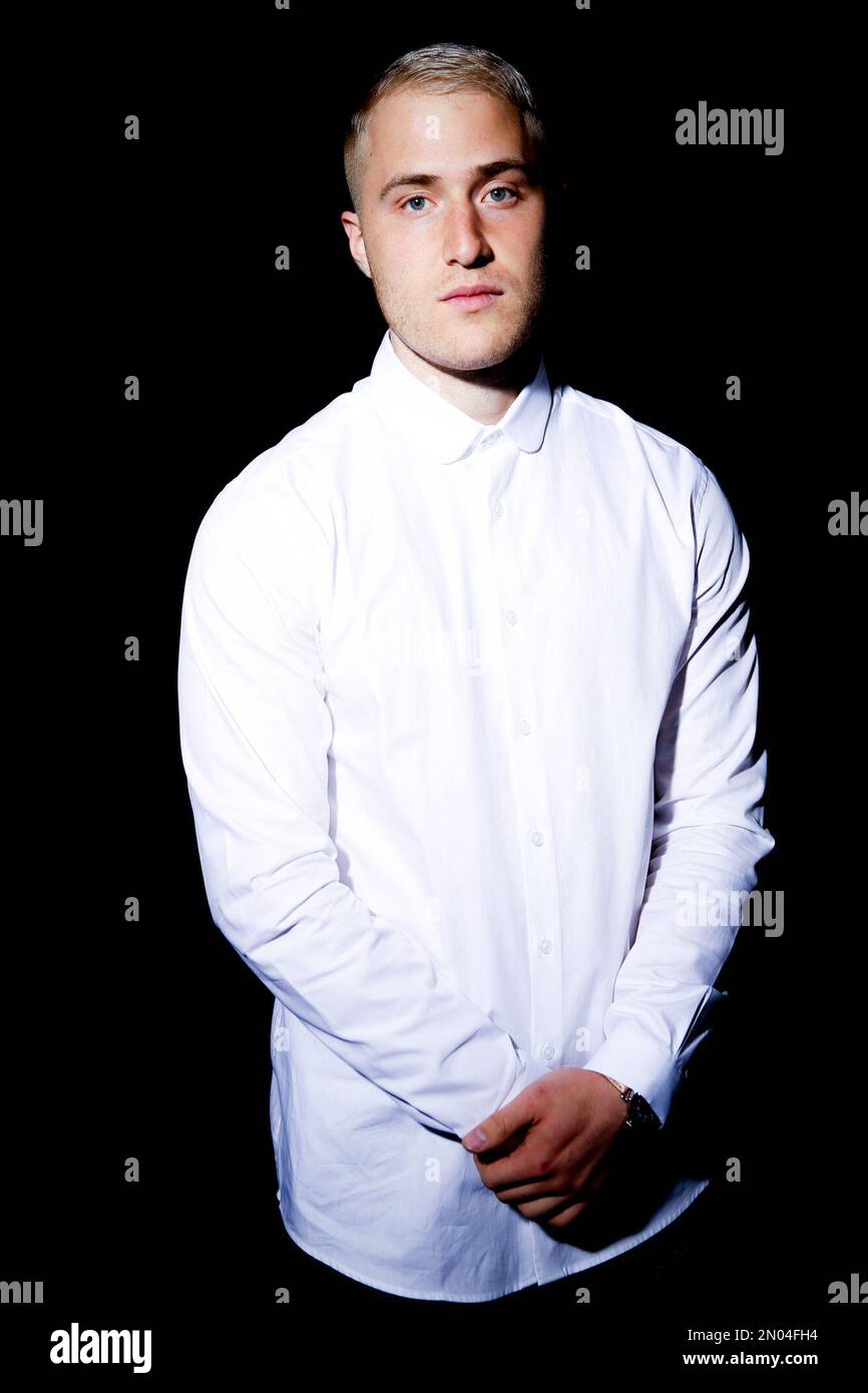 In this March 4, 2016 photo, singer-songwriter Mike Posner poses for a
