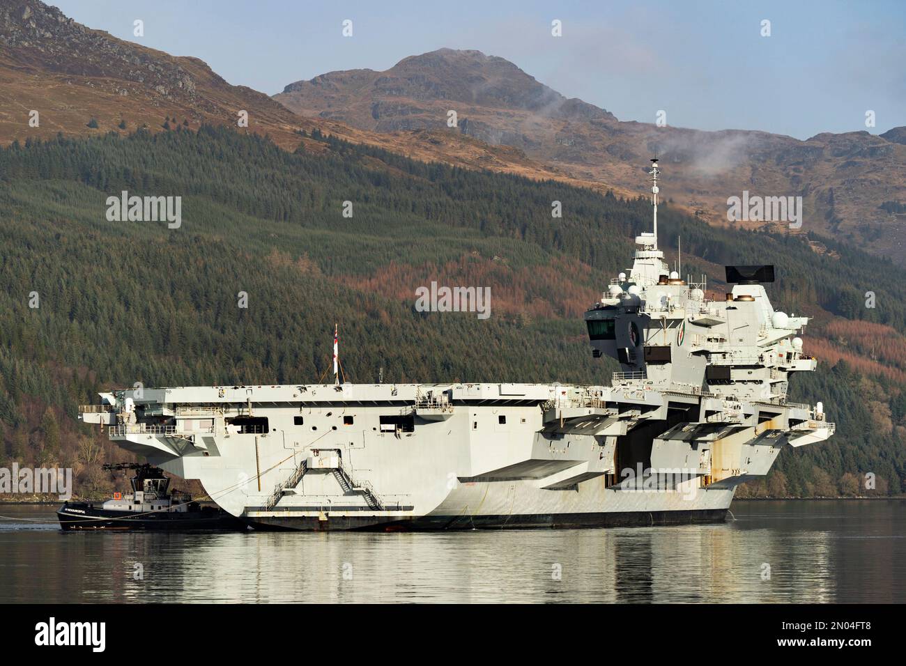 Glenmallan, Argyll and Bute, Scotland, UK. 5 February 2023.  Royal Navy aircraft carrier HMS Queen Elizabeth arrives at Glenmallan on Loch Long this morning to receive supplies of munitions prior to her next deployment.  Credit Iain Masterton/Alamy Live News Stock Photo