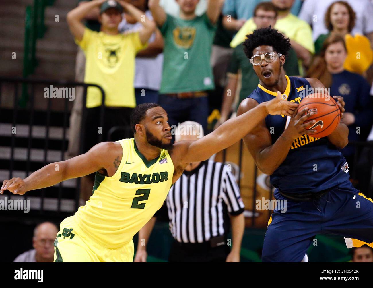 Devin Forward Baylor forward Rico Gathers, left, reaches in on West Virginia forward ...
