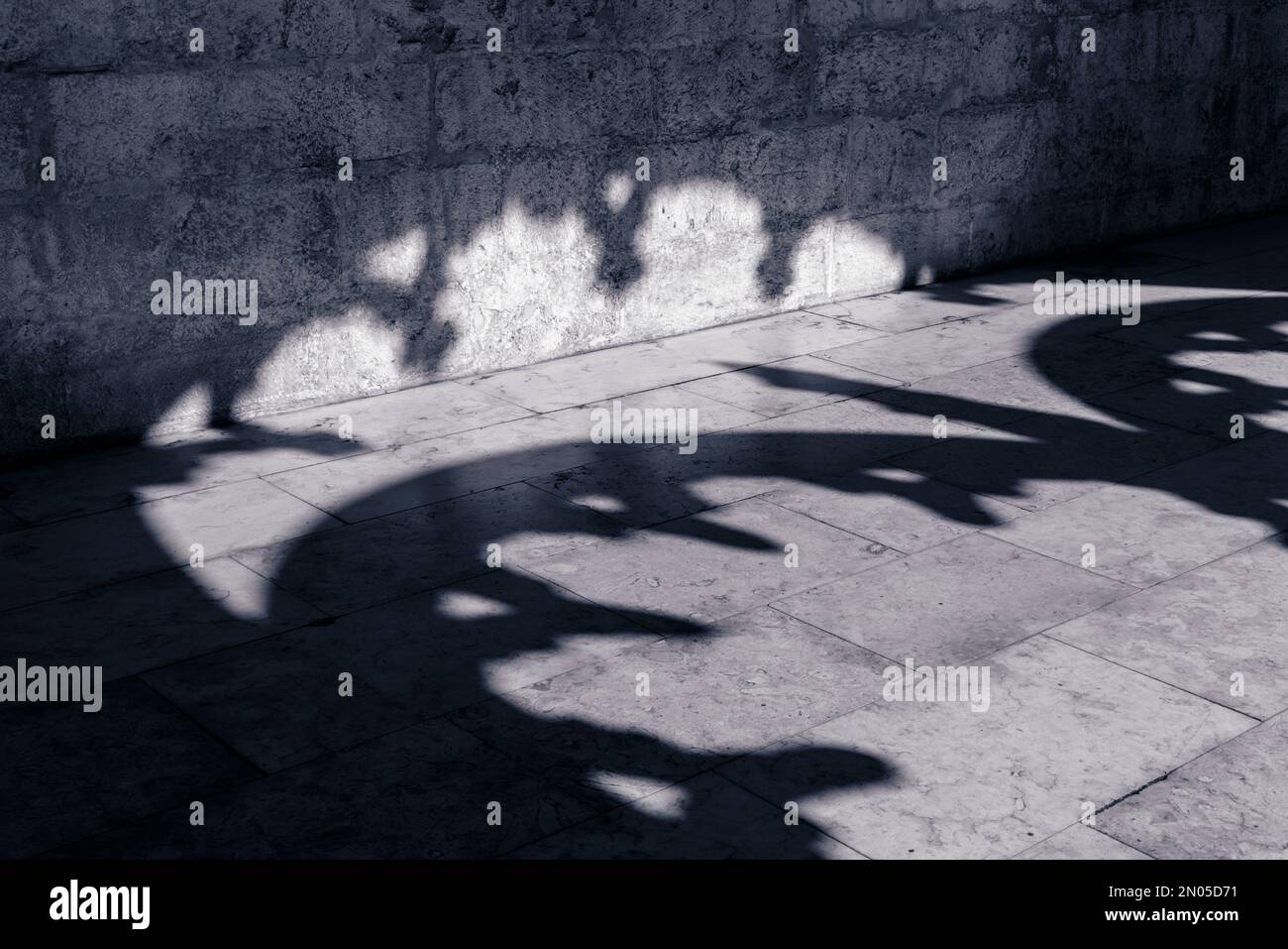 Lisbon, Portugal. Shadows in the cloister of the Mosteiro dos Jeronimos/Monastery of the Hieronymites. The monastery is considered a triumph of Manuel Stock Photo