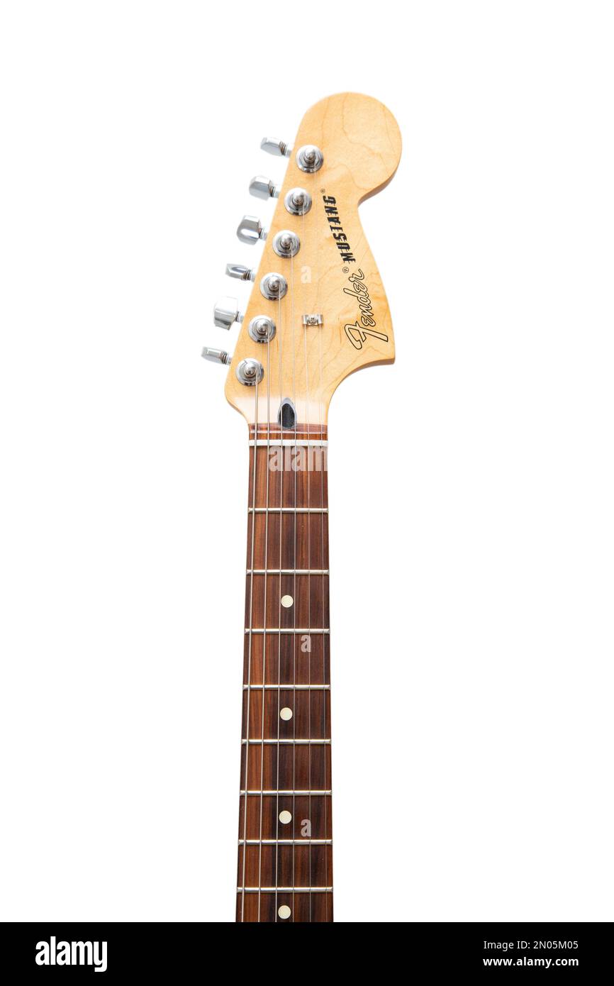 Fender mustang guitar neck and headstock on clear plain background. Stock Photo