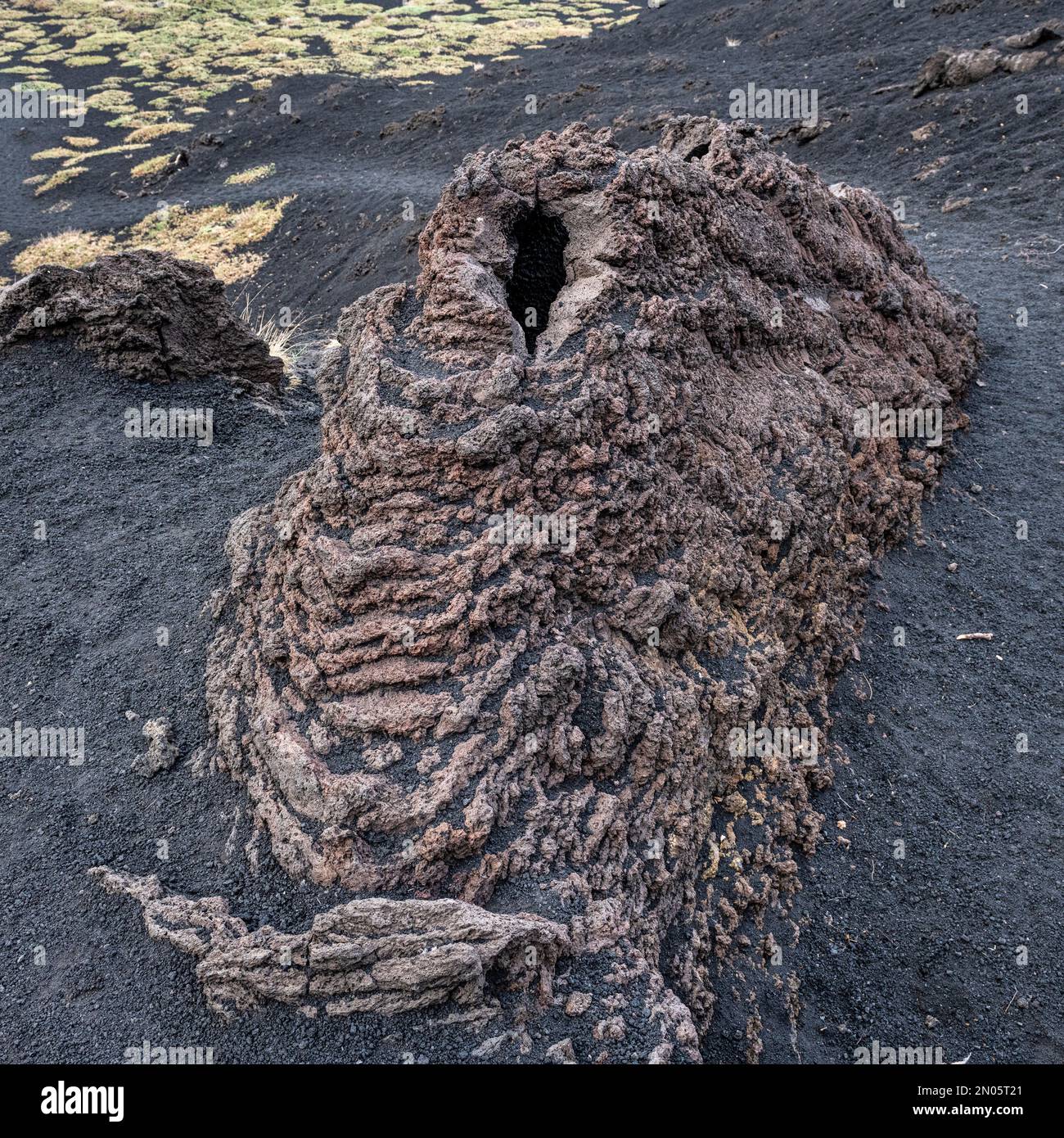 A 'hornito' on an old lava flow (1971) on Mount Etna, Sicily. They are formed by lava being forced upwards through the crust of a lava flow Stock Photo