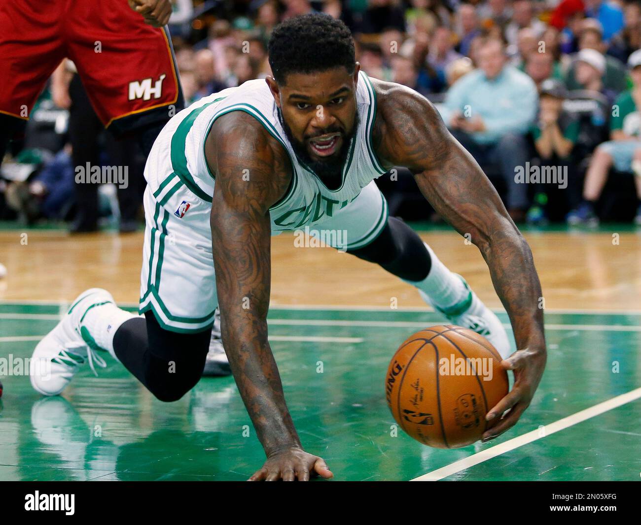 Boston Celtics Amir Johnson keeps the ball in bounds during the second half of the Boston Celtics 99 89 win over the Miami Heat in an NBA basketball game in Boston Saturday Feb