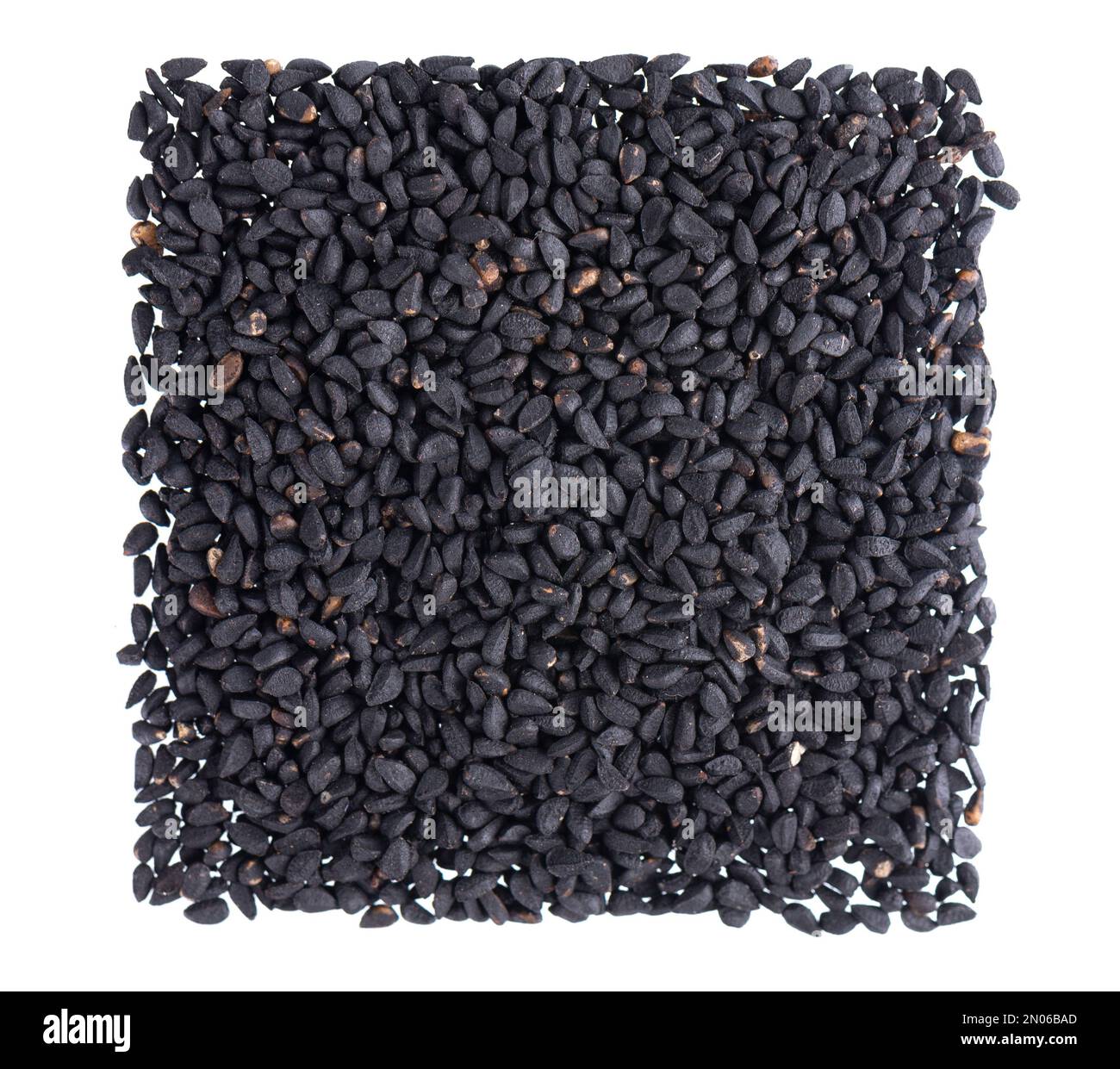 Black cumin seeds isolated on white background. Heap of black nigella