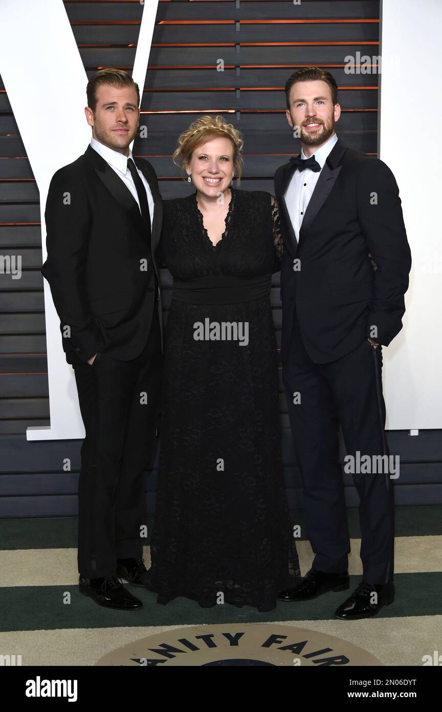 Scott Evans, from left, Carly Evans, and Chris Evans arrive at the