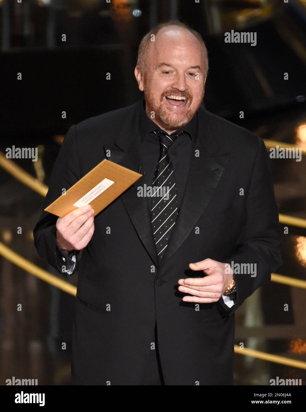 Louis C.K. presents the award for best documentary short subject at the  Oscars on Sunday, Feb. 28, 2016, at the Dolby Theatre in Los Angeles.  (Photo by Chris Pizzello/Invision/AP Stock Photo 