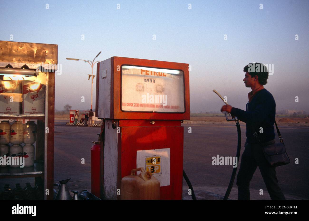 Rajasthan India Man Holding Petrol Pump At Petrol Station Stock Photo
