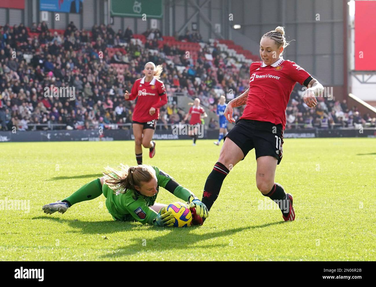 Everton goalkeeper Courtney Brosnan saves at the feet of Manchester