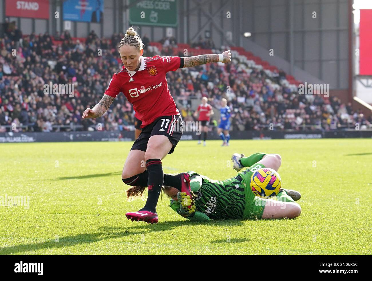 Everton goalkeeper Courtney Brosnan saves at the feet of Manchester