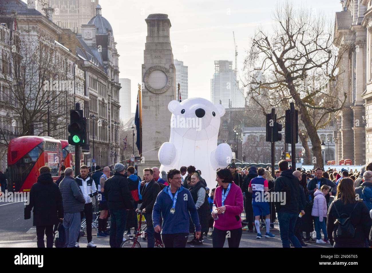 London, UK. 5th February 2023. An inflatable polar bear greets participants at the finish line in Whitehall during this year's Cancer Research UK Winter Run in central London. Thousands of runners take part in the annual event raising funds for cancer research. Credit: Vuk Valcic/Alamy Live News Stock Photo