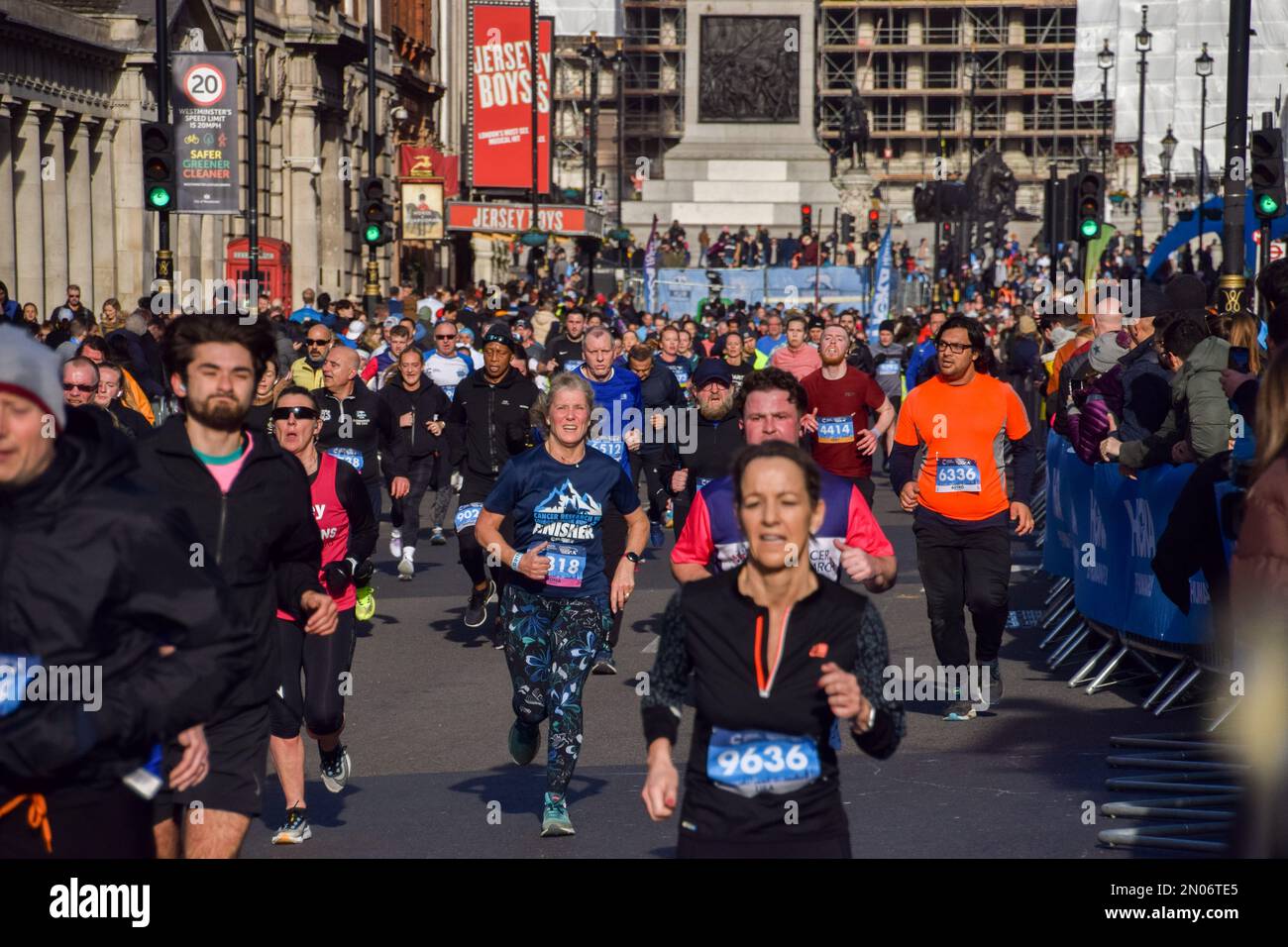 London, UK. 5th February 2023. Participants pass through Whitehall during this year's Cancer Research UK Winter Run in central London. Thousands of runners take part in the annual event raising funds for cancer research. Credit: Vuk Valcic/Alamy Live News Stock Photo