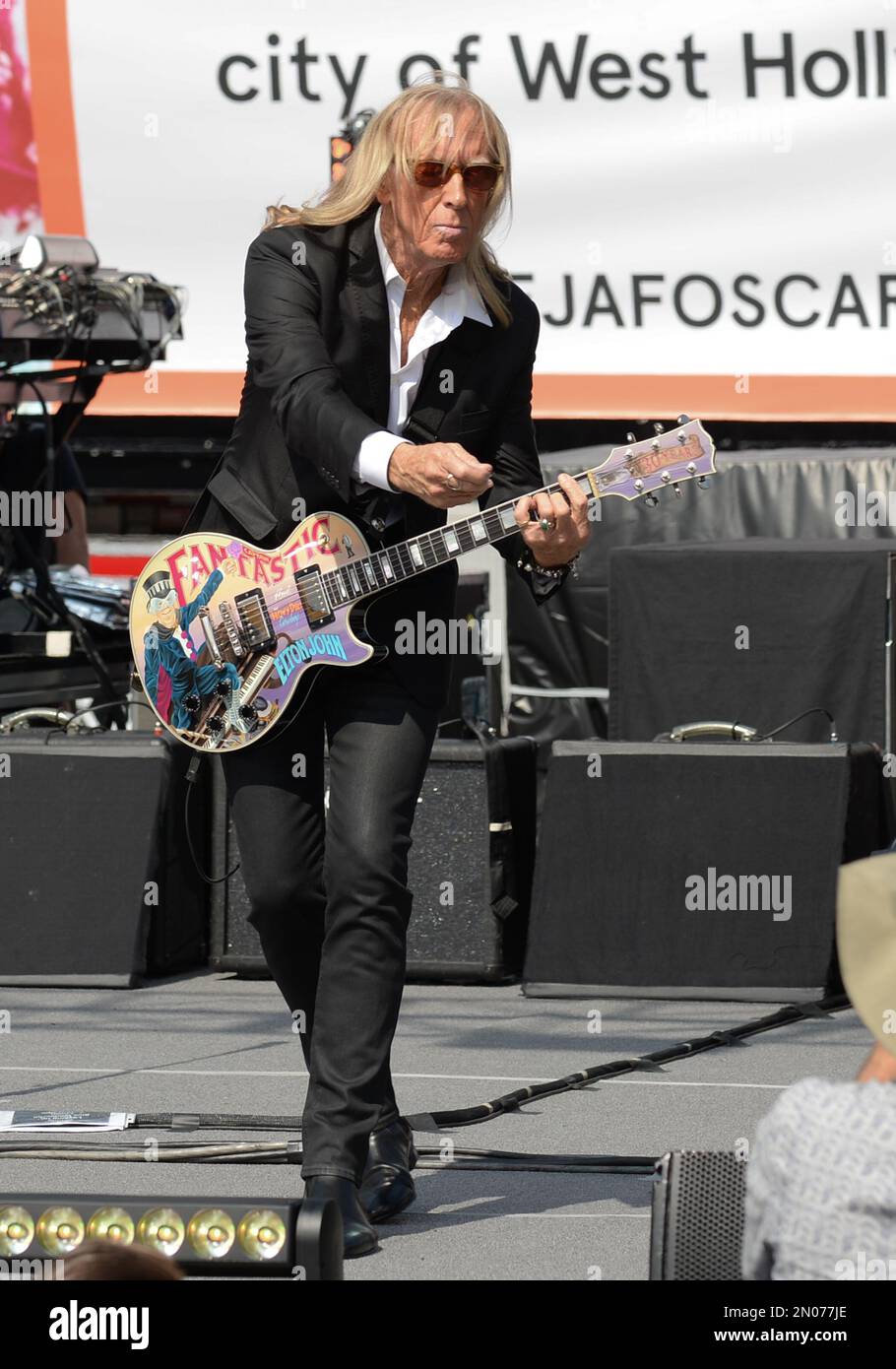 Guitarist Davey Johnstone performs live on the Sunset Strip with Elton