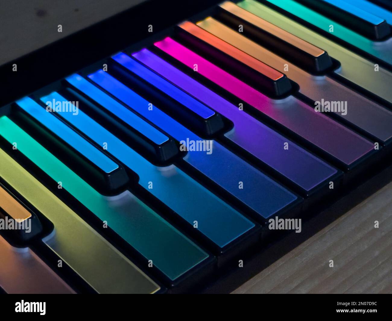 a detail of a colourful, illuminated, computer music, midi keyboard Stock Photo