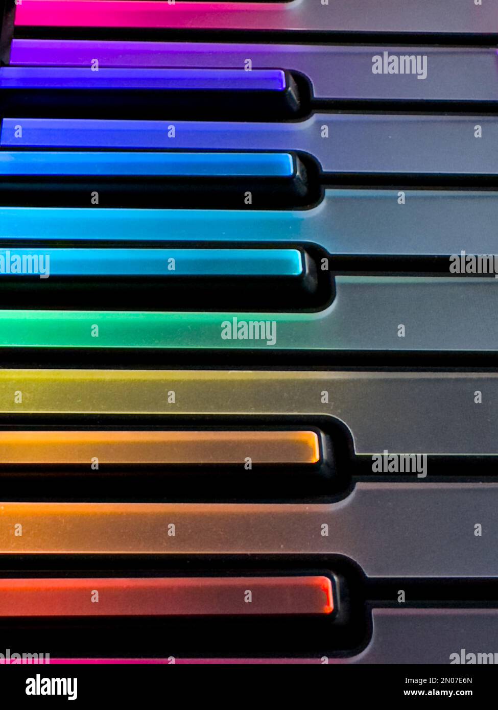 a detail of a colourful, illuminated, computer music, midi keyboard Stock Photo