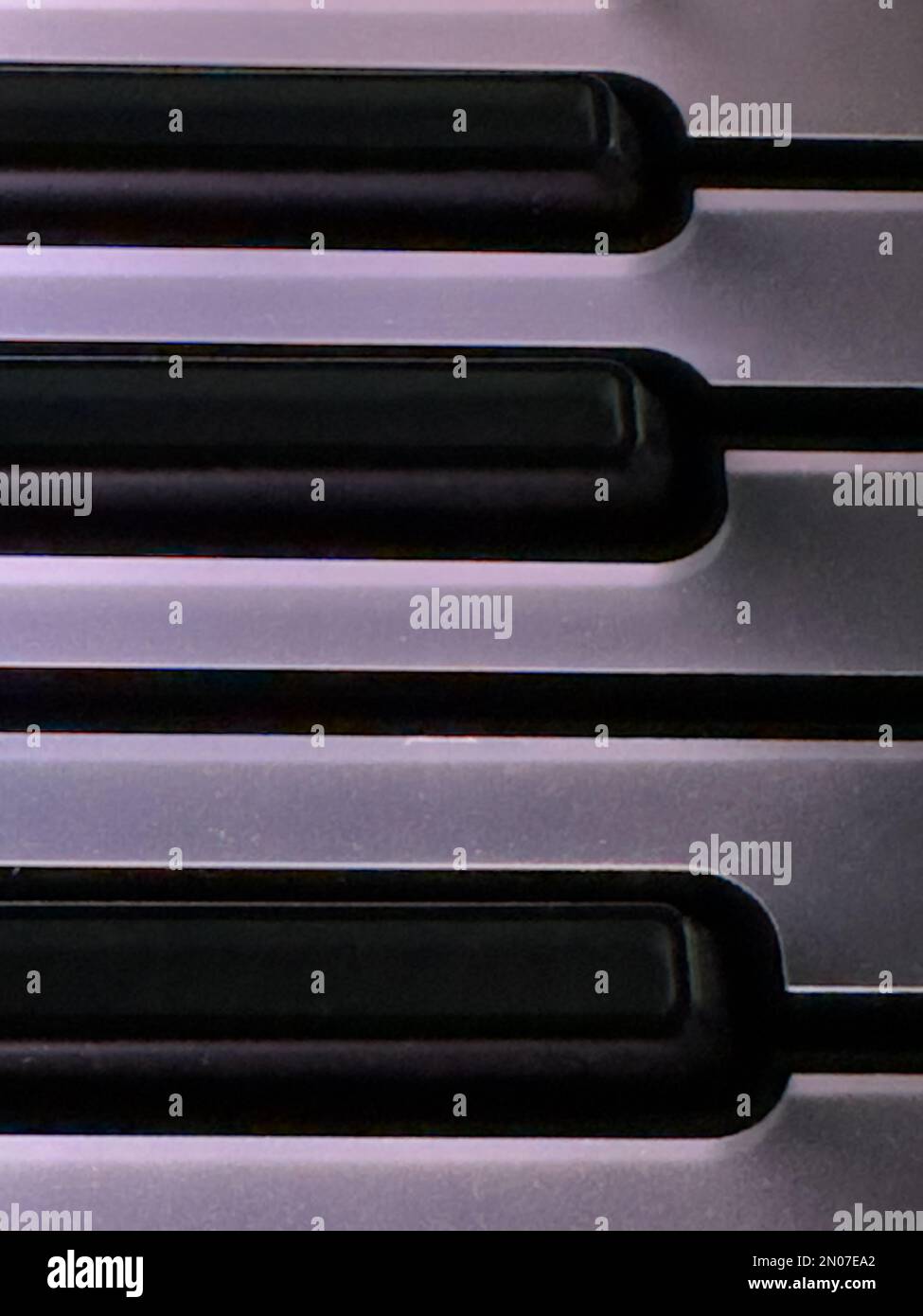a detail of a colourful, illuminated, computer music, midi keyboard Stock Photo