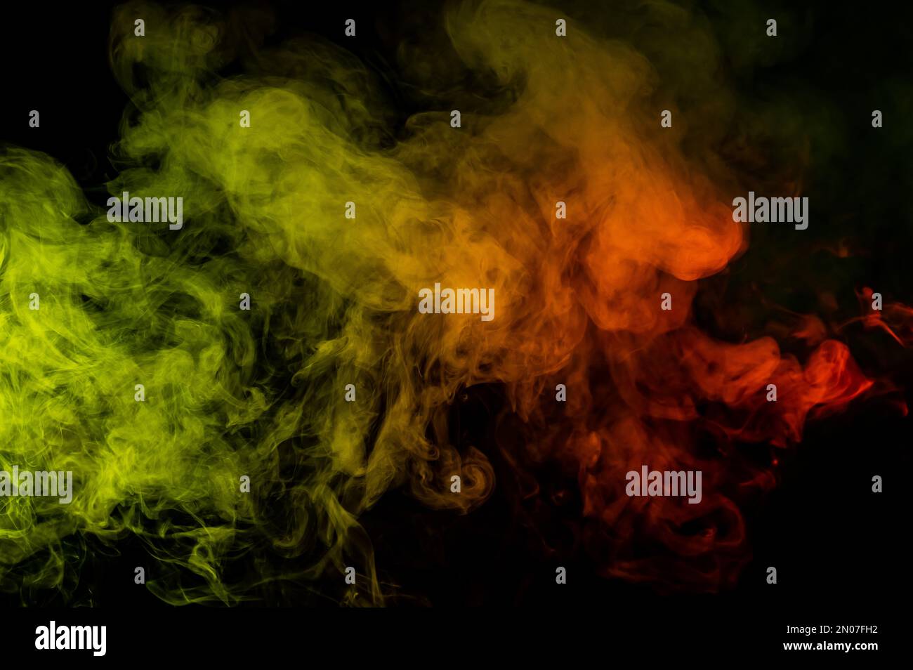 Red yellow green smoke on a black background Stock Photo - Alamy
