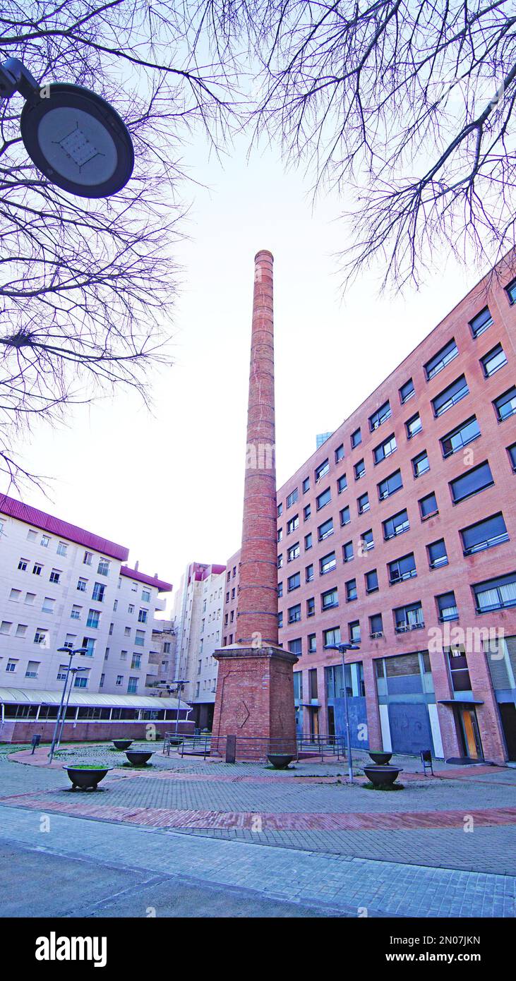 Ornamental industrial chimney in a square in Sabadell, Barcelona, Catalonia, Spain, Europe Stock Photo