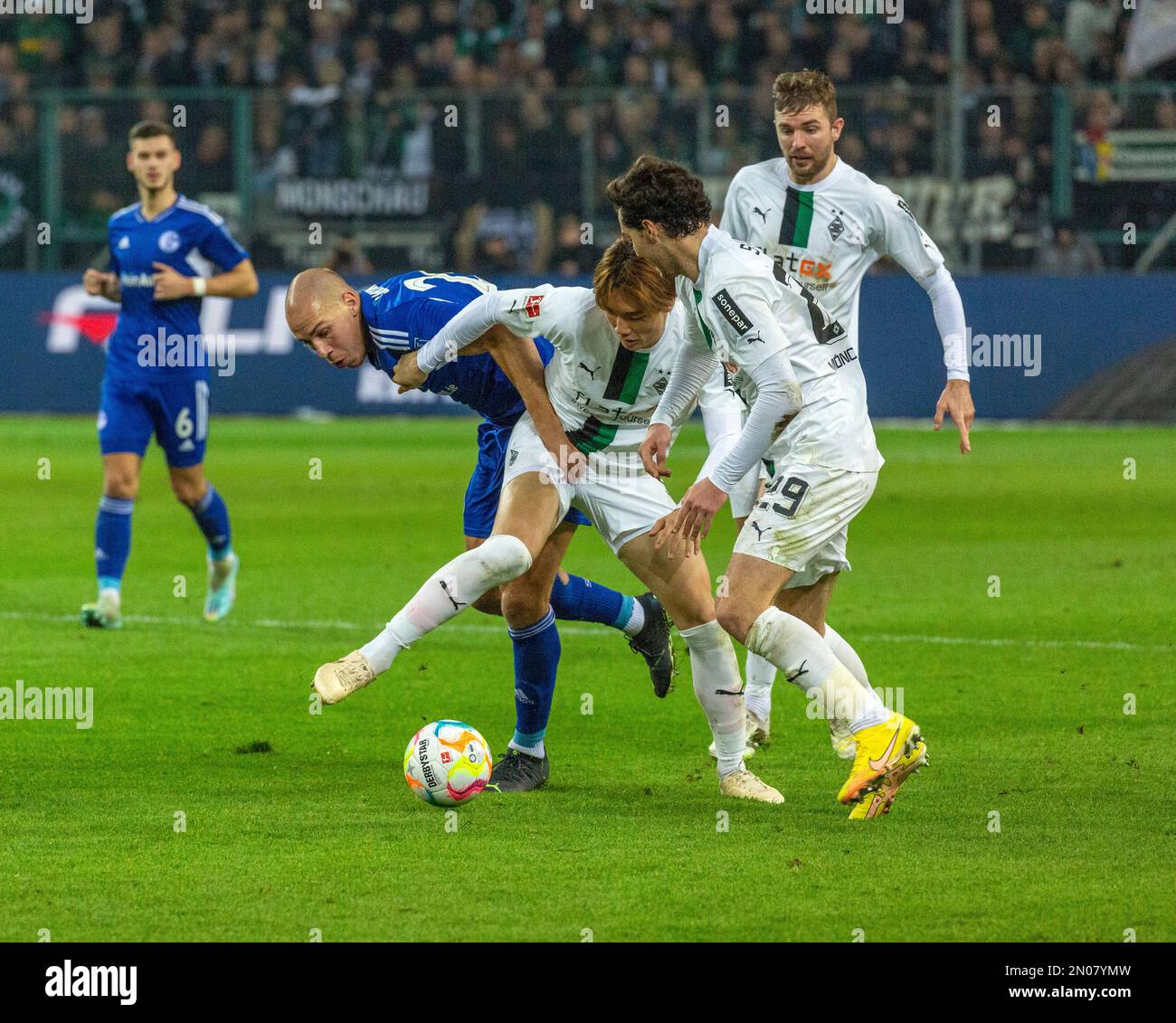 sports, football, Bundesliga, 2022/2023, Borussia Moenchengladbach vs. FC Schalke 04 0-0, Stadium Borussia Park, scene of the match, f.l.t.r. Tom Krauss (S04), Michael Frey (S04), Kou Itakura (MG), Joseph Michael Scally (MG), Christoph Kramer (MG), DFL REGULATIONS PROHIBIT ANY USE OF PHOTOGRAPHS AS IMAGE SEQUENCES AND/OR QUASI-VIDEO Stock Photo