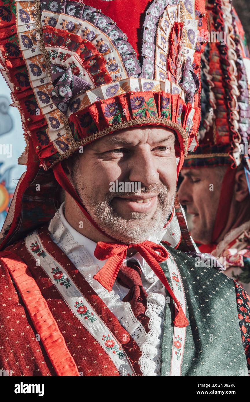 Rore (Cuneo), Italy. February 5th, 2023. The Baìo is a traditional historical celebration that is organized every five years in some localities in the upper Varaita valley (in the province of Cuneo). The celebration aims to recall some historical events that took place in the early years of the Middle Ages. One of the characteristics of the festival is made up of handmade, complex and very colorful costumes. During the celebration, some people play traditional musical instruments from the Alpine valleys. Credit: Luca Prestia / Alamy Live News Stock Photo