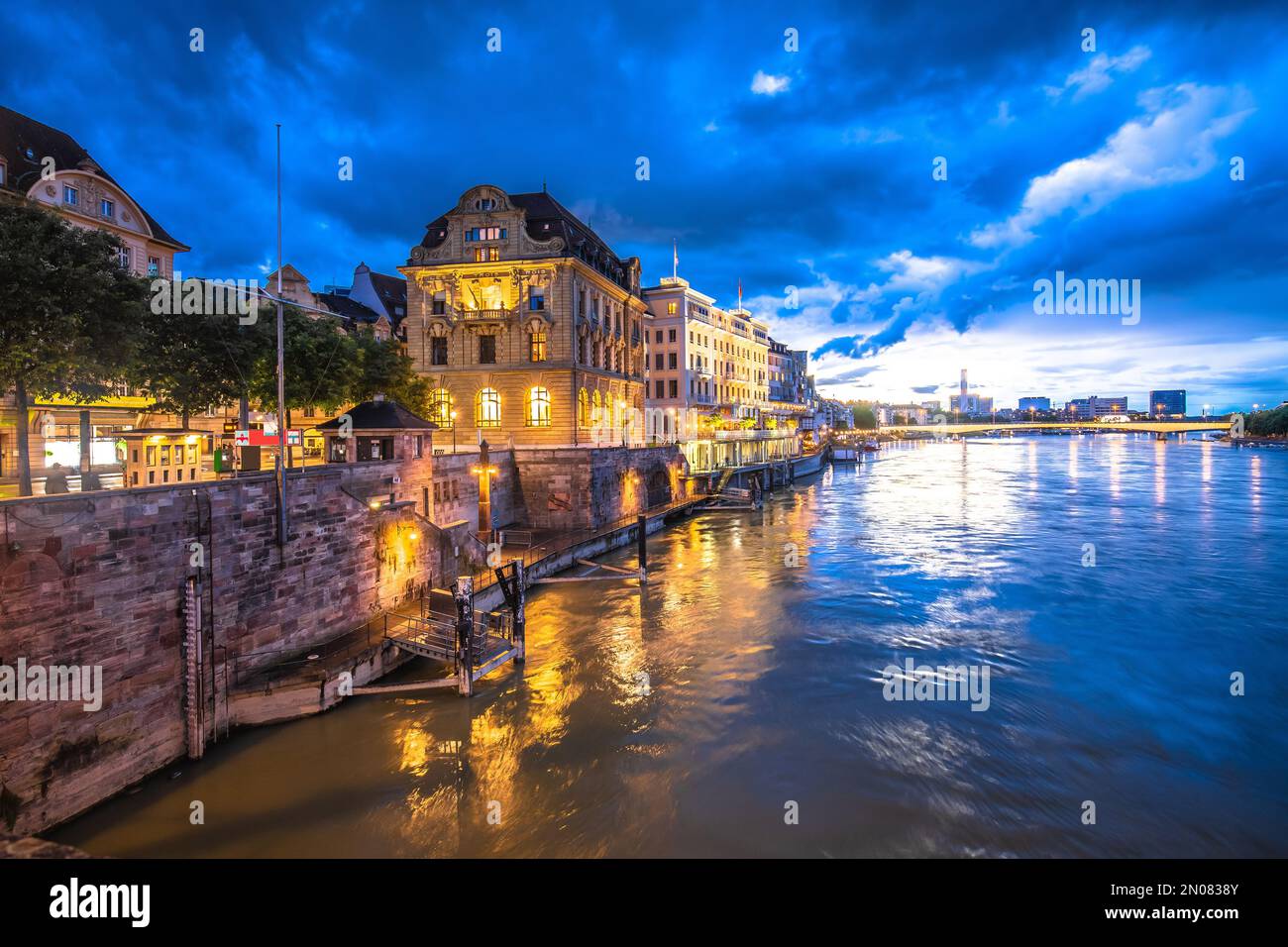 Basel historic waterfront and Rhine river architecture evening view, Switzerland Stock Photo